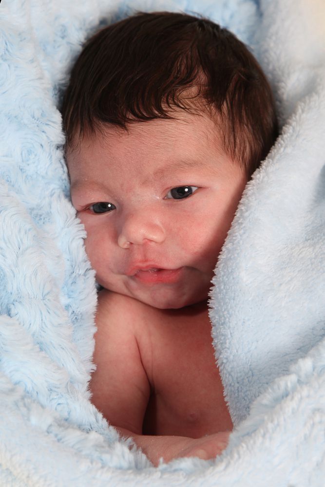 baby cozy and wrapped up in fussy towel